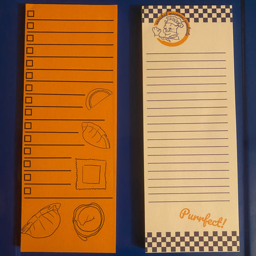 Two list note pads next two each other, the left one is yellow with a pasta design and checkboxes, the right has a blue and white checkered design with the Enriched Macaroni Products logo at the top
